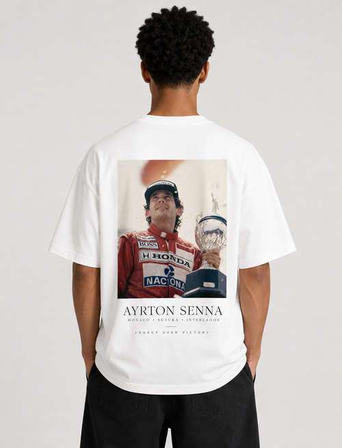 Person wearing a white t-shirt with Ayrton Senna graphic on the back
