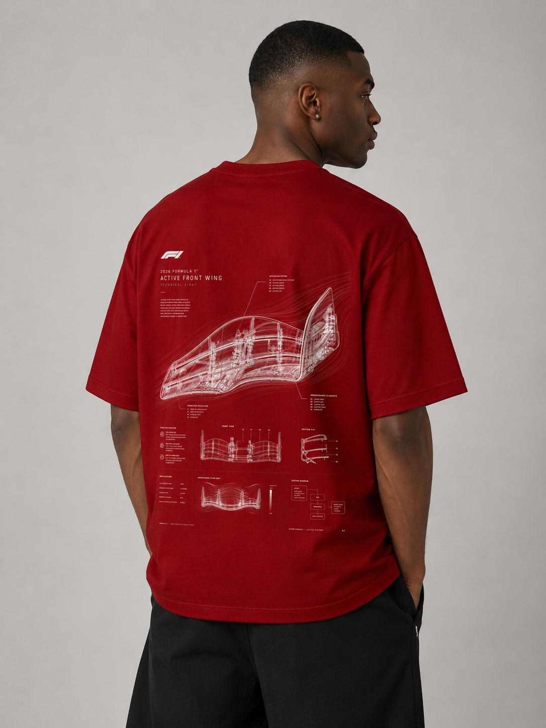 Person wearing a red t-shirt with a white graphic design on the back against a plain background