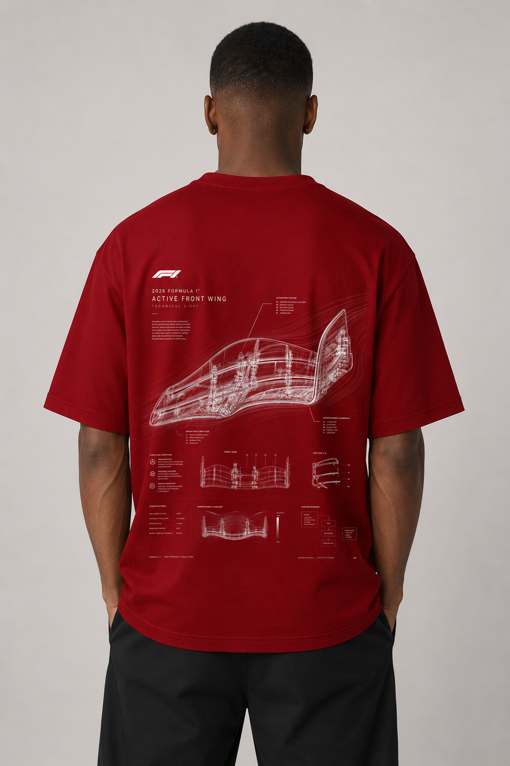 Person wearing a red t-shirt with technical drawings on the back against a plain background