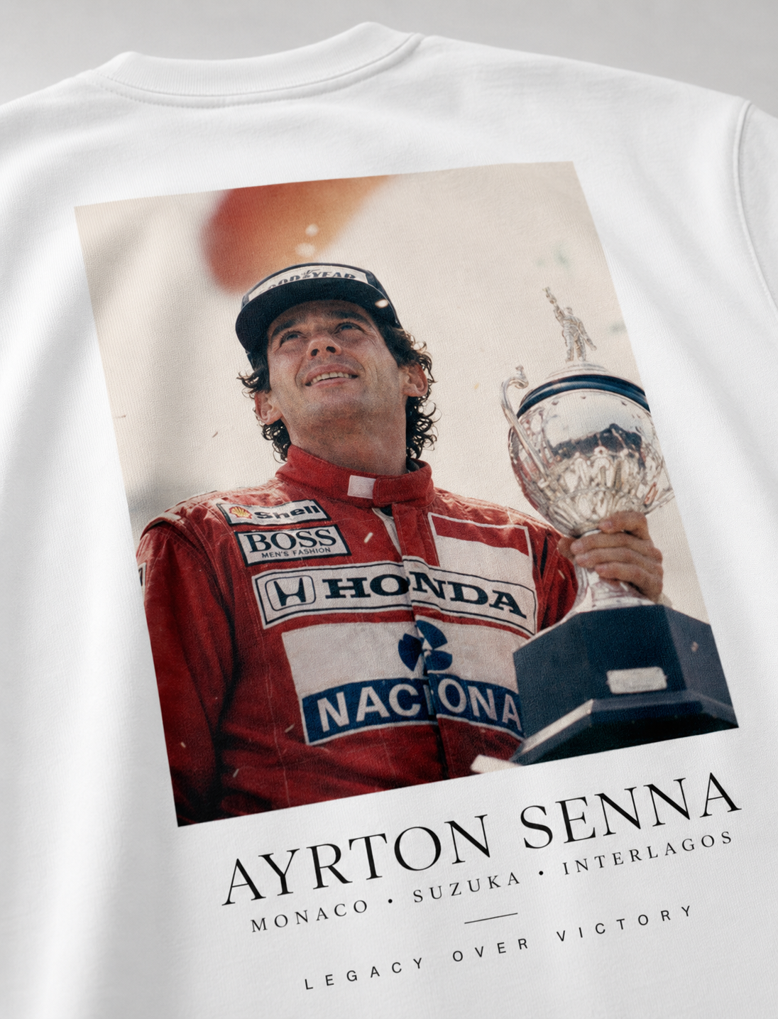White t-shirt with Ayrton Senna graphic and trophy, featuring Honda and Naciona logos.